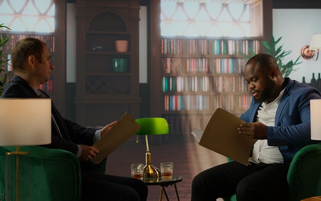 Multicultural top secret agents in a bureau reading confidential documents